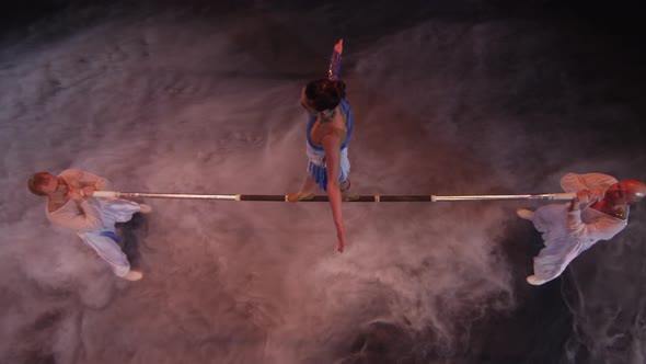 Acrobatics on horizontal bar in circus