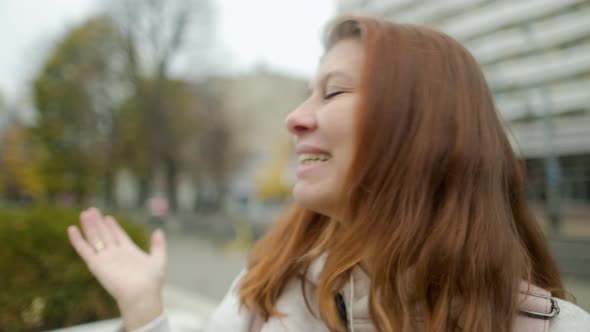 Beautiful Woman In The City Drinks Coffee