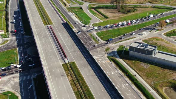 Drone shot highway motorway showing lanes with Tunnel and viaducts outside the city of Warsaw, Polan