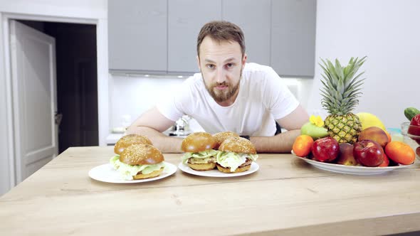 Man Is Choosing Between Healthy Food And Fast Food