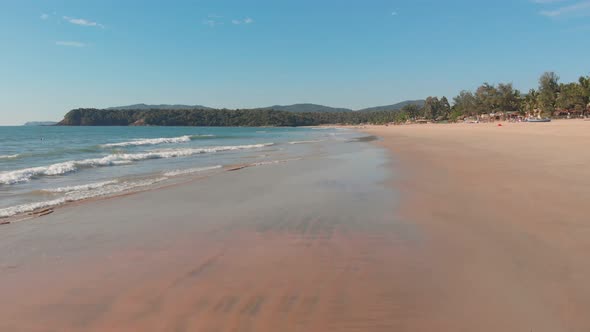 Low Drone Flight Over the Waves of Agonda Beach