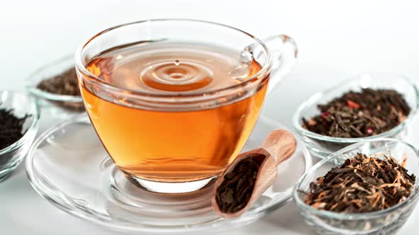 Super Slow Motion Shot of Droplet Falling Into Tea at 1000 Fps.