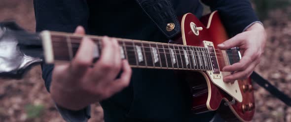 Guitar Player in the Woods