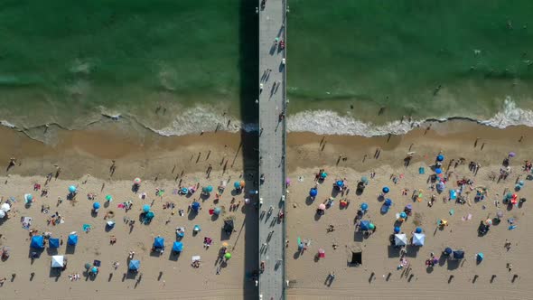 Top Down View Of Tourists At Manhattan Beach In California - Timelapse