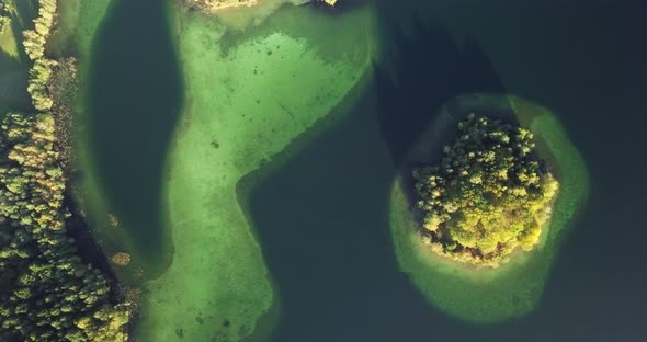 Top view above the green island in the lake