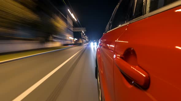 Drivelapse From Side of Car Moving on a Night Avenue in City Timelapse Hyperlapse