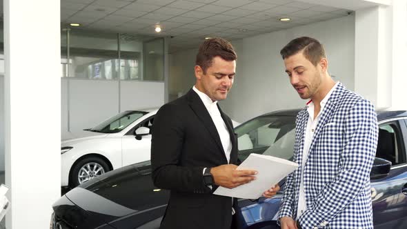 Potential Buyer and Seller Read the Characteristics of the Car