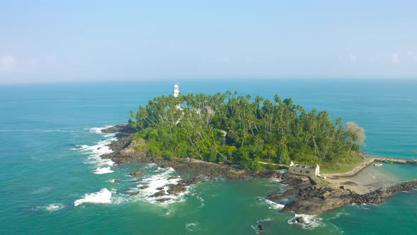 Beautiful Old White Lighthouse on Triopical Island