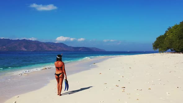 Tourists look beautiful on relaxing resort beach adventure by clear sea with white sandy background 