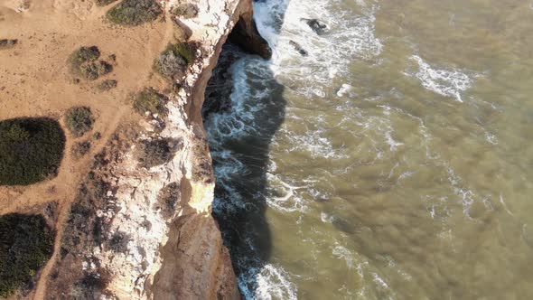 Atlantic Ocean waves on rocky coast,  Benagil Cave,  Lagoa, Algarve, Portugal