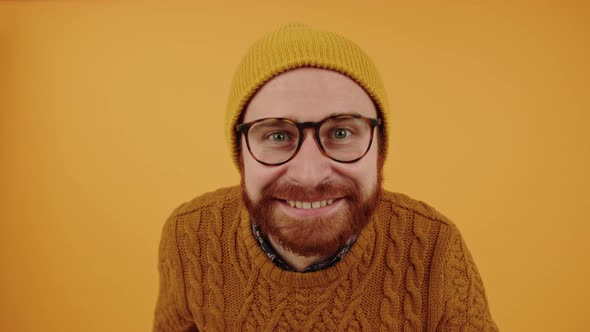 Young Handsome Bearded Caucasian Man Looking at the Camera Smiling and Shaking His Head Isolated