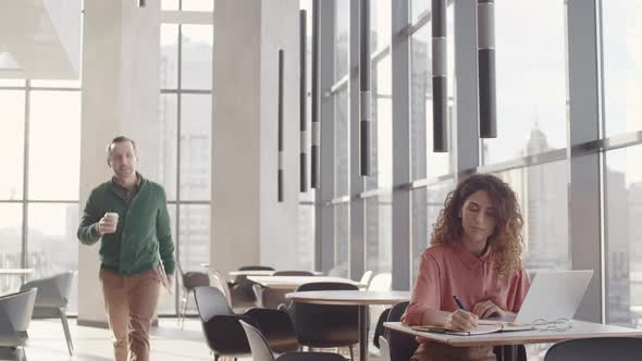 Two Colleagues Meeting in Modern Open-space Office