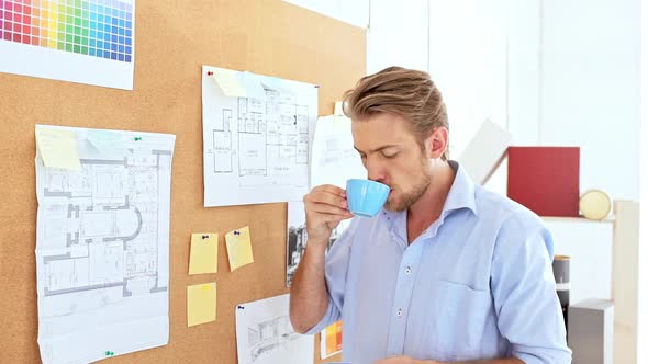 Architector Standing Near Board Drinking Coffee Smiling Slow Motion