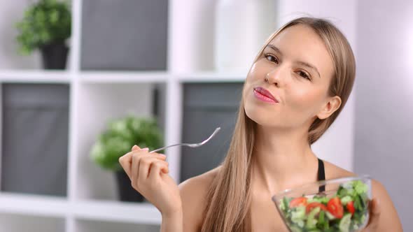 Closeup Face of Smiling Young Beauty Girl Eating Appetizing Vegetarian Salad