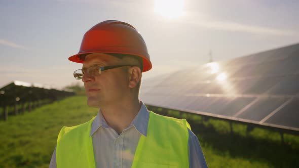 Portrait of Happy Male Engineer in Protective Helmet Looking to Camera