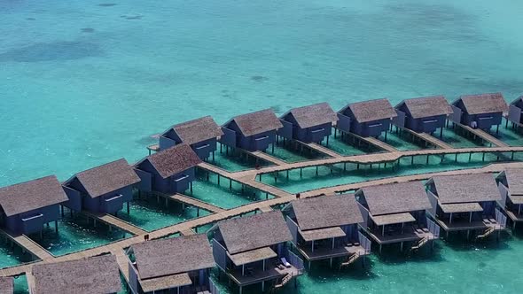 Aerial drone landscape of bay beach by blue water with sand background