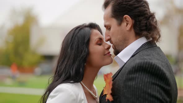 the Groom Kisses the Bride on the Nose