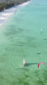 Vertical Video Kitesurfing Near the Shore of Zanzibar Tanzania