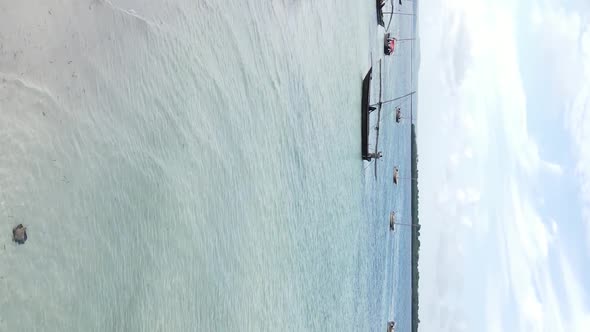 Vertical Video Boats in the Ocean Near the Coast of Zanzibar Tanzania Aerial View