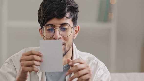 Portrait Young Arabic Man Bearded Ecstatic Guy with Glasses Sits at Home Indoors Receives Envelope