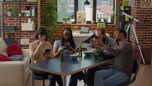 Millennial People Hanging Out Together and Browsing Internet