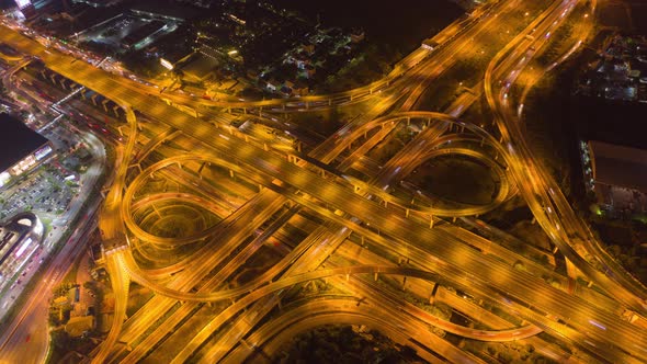 Hyper lapse of Aerial view of cars driving on highway junctions. Bridge roads shape number 8,Bangkok