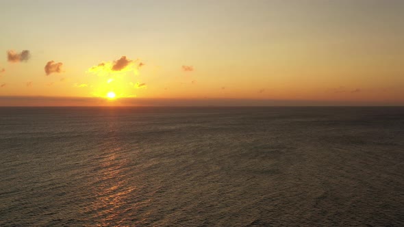 Aerial Over Calm Sea at Bornholm Island at Golden Sunset