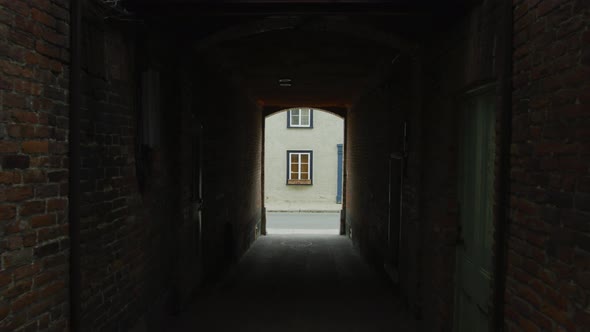 Passage between two brick buildings