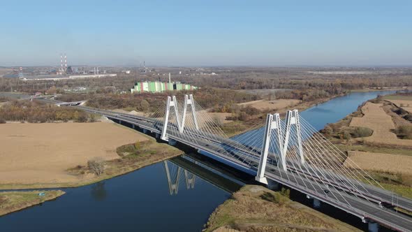Drone at Macharski bridge reflecting in Vistula (Wisla) river in Krakow, Poland