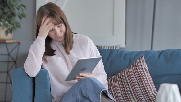 Young Girl Upset by Results on Tablet Screen