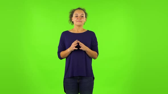 Curly Woman Looking at the Camera with Excitement, Then Celebrating Her Victory Triumph . Green