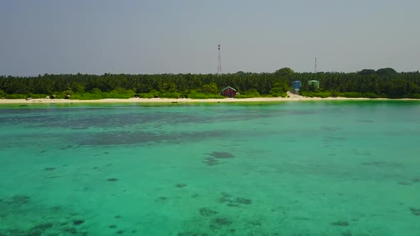 Aerial drone scenery of island beach by lagoon with sand background