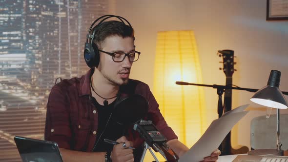 Radio News Anchorman Working in the Evening in Home Studio