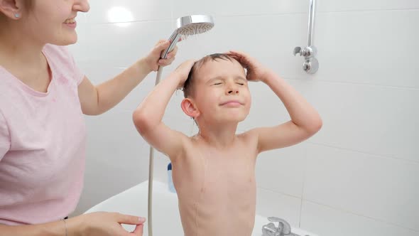 Little Boy with Mother Taking Bath and Washing Under Shower