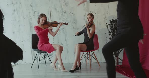 Dancers Couple in Black Clothes Perform Dance to Accompaniment of the Violin