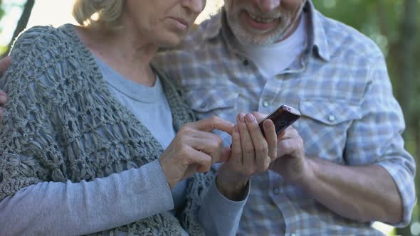 Senior Couple Using Simple Mobile App on Gadgets, Modern Technology, Services