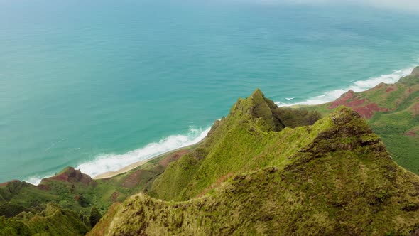 Aerial View Over Impressive Steep Mountain Precipice of Triangular Shape at the Hawaiian Coast