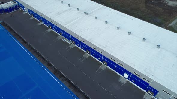 Aerial Top Down View of the Large Logistics Park with Warehouse Without Semi-trailers Trucks.