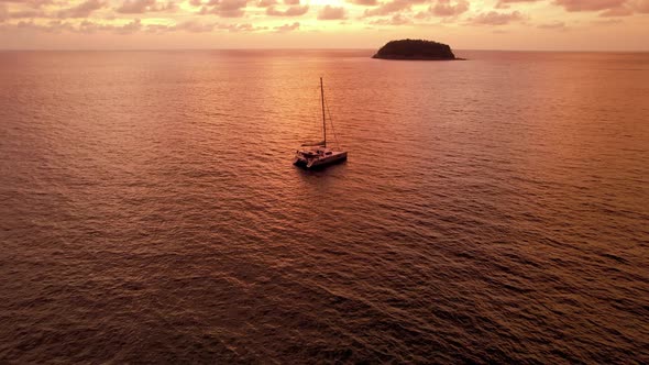 Luxury Yacht at Sunset with a View of the Island