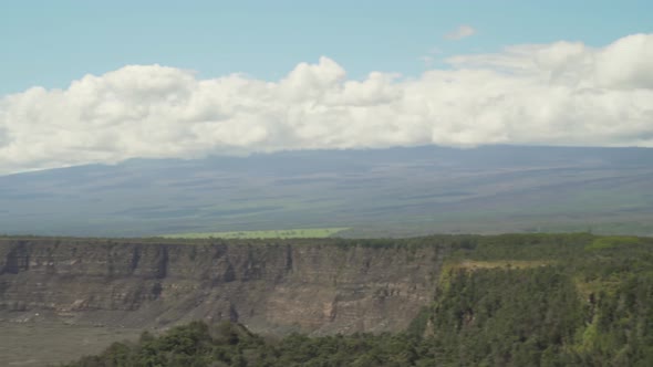 Fast pan of Mauna Loa and volcano crater from right to left