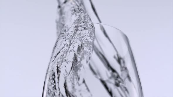 Pouring water into glass, Slow Motion