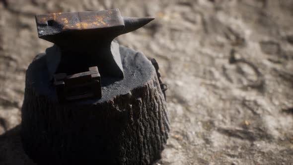 Old Anvil Attached To a Stump