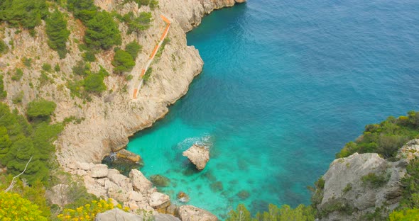 View Of Cliffs And Turquoise Sea In Capri, Italy - high angle shot