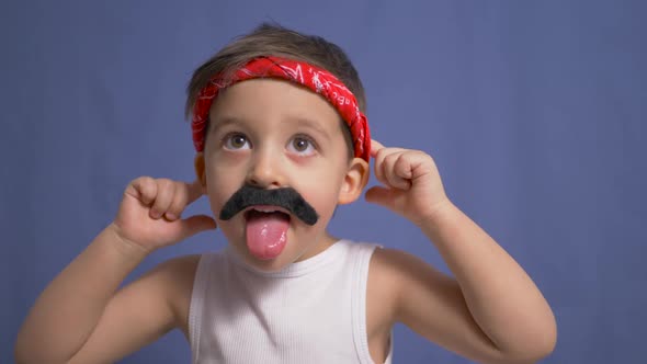 Funny Mexican Boy with a Big Black Mustache and a White t Shirt