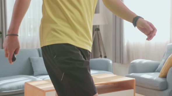 Asian Man Training On Walking Treadmill At Home