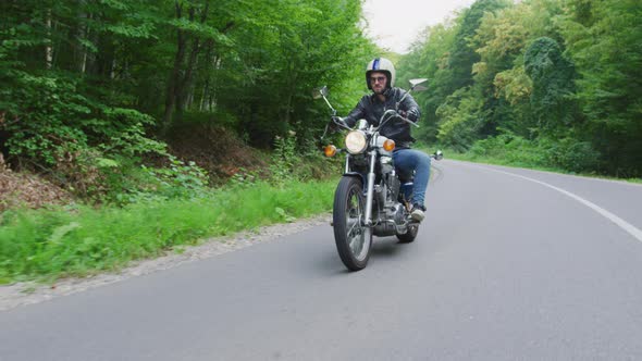 Riding a motorcycle on a forest road