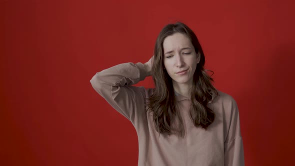 Portrait of a Thoughtful Young Woman with Long Hair Thinking Intensely Pondering a Solution to a