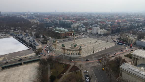 4K drone shot over Heroes square in Budapest Hungary during a foggy day 1