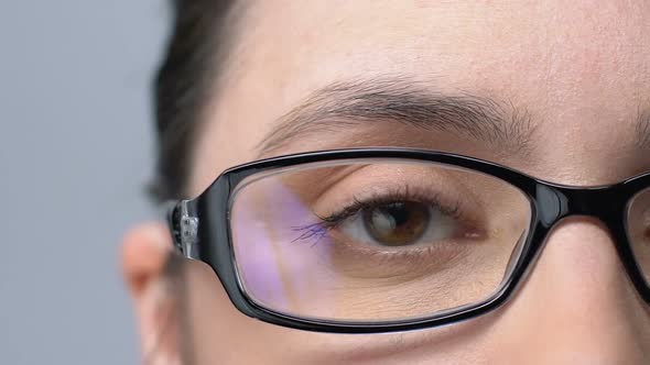 Woman in Glasses Blinking, Tired of Bad Vision, Eyesight Problems, Close-Up