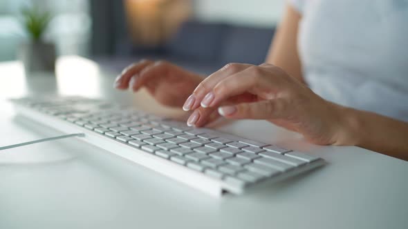 Female Hands Typing on a Computer Keyboard